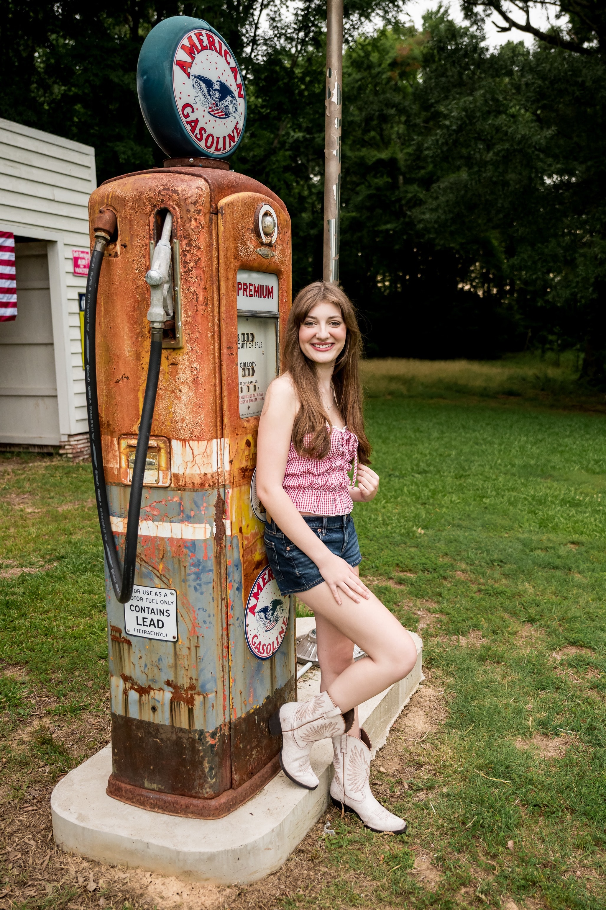 Savannah Lynn — beside vintage American Gasoline pump