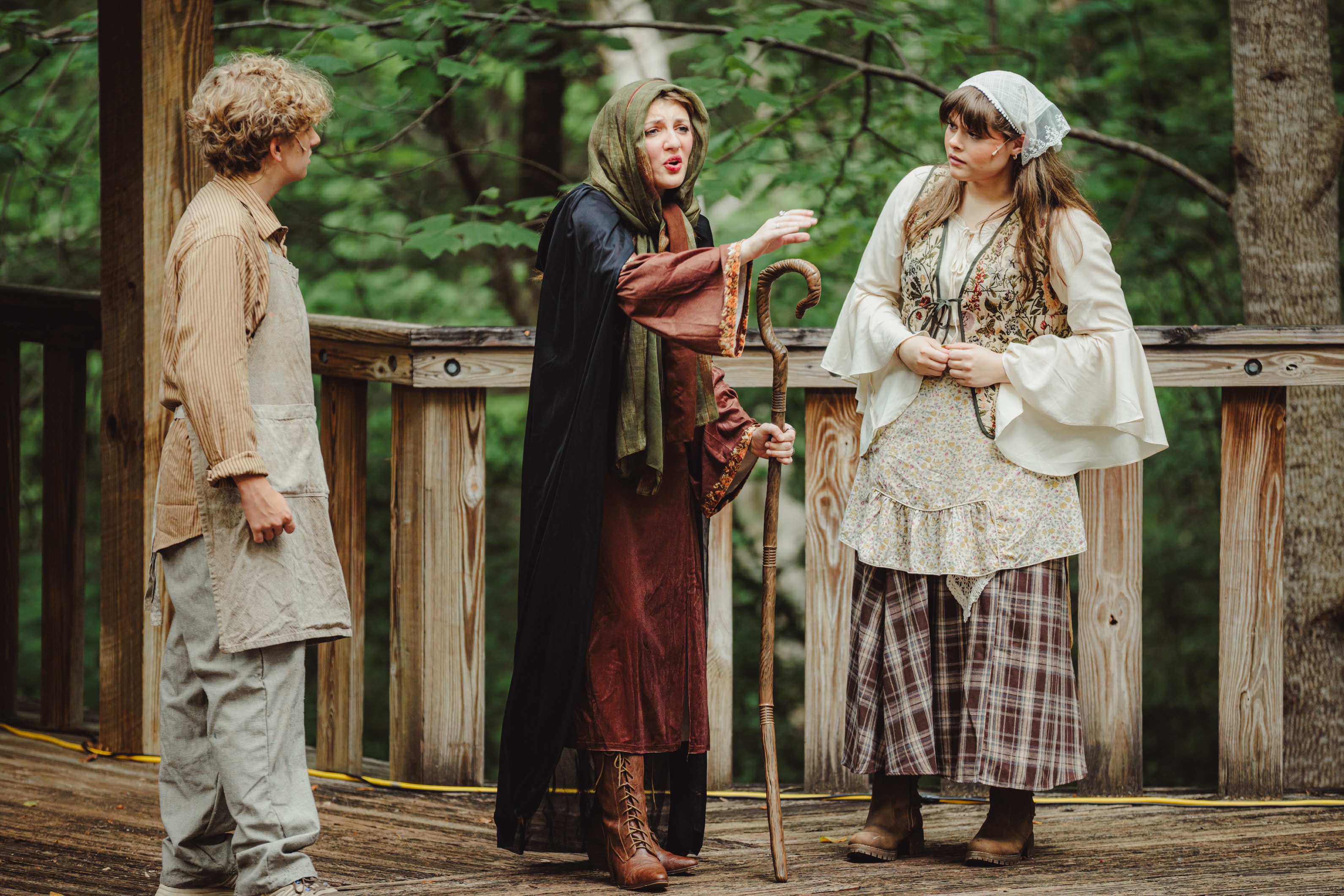 Savannah Lynn as the Witch in a scene with two other actors, Into the Woods