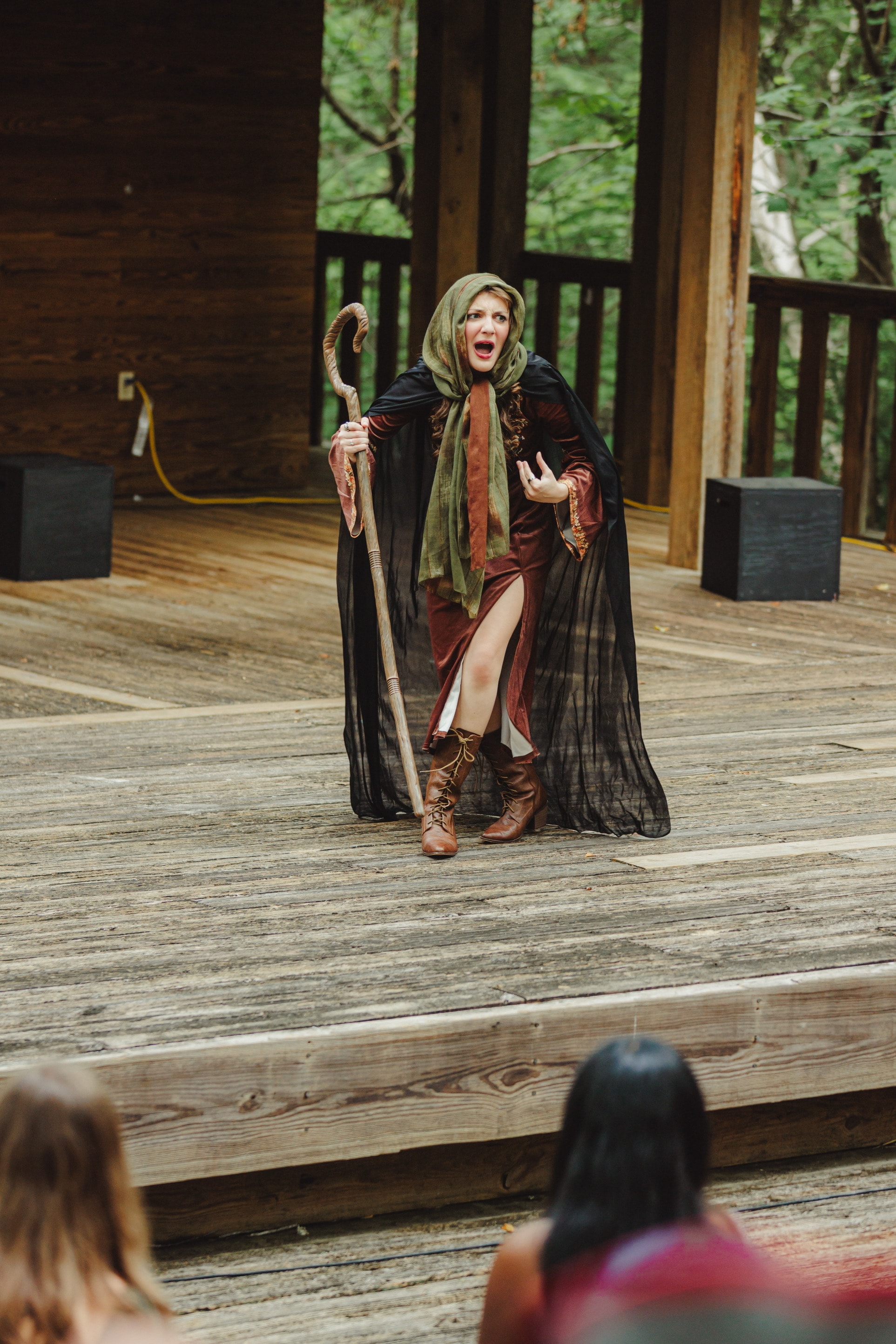 Savannah Lynn as the Witch performing on stage, Into the Woods